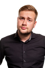 Obraz premium Young man wearing black shirt over isolated background thinking about question, pensive expression.