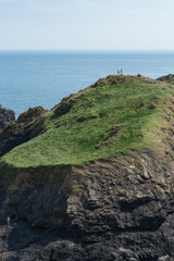 Exploring the rocks, Kynance Cove, Cornwall, UK
