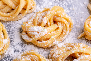 pasta with pasta ingredients on the dark wooden table top view