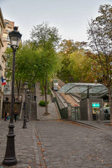 The Montmartre Funicular carries passengers at the summit of the hill, near the foot of the Sacré Coeur Basilica, an alternative to the stairs of more than 300 steps