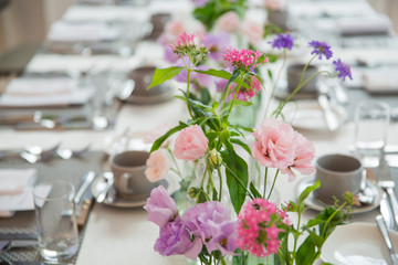 Party table decorated with beautiful flowers