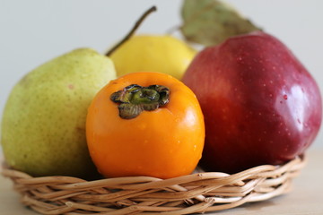 Ripe persimmon, apple, quince and pear 