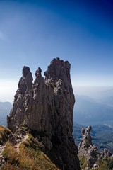 Panoramic view of the towers and spiers of the southern Grigna from the direct route, on a sunny autumn day.