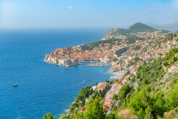 Scenic view of historic part of ancient touristic town Dubrovnik in Croatia. Beautiful aerial view of old european resort on Adriatic sea.