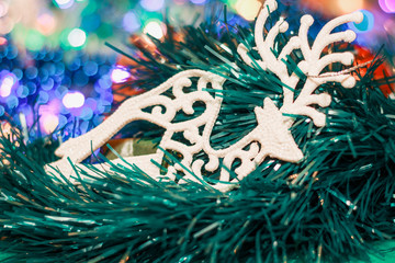 Happy New Year and Merry Christmas. Christmas garland, lights, toys.
