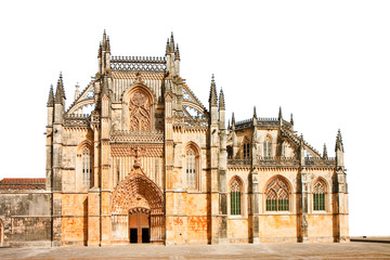 The facade of Batalha cathedral in Portugal with the ornate facade in manueline style (Europe) - image on white background for easy selection