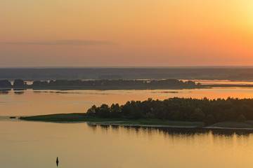 Sunrise over the river in the summer