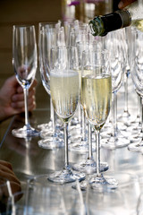 Pour the champagne into the flute glass