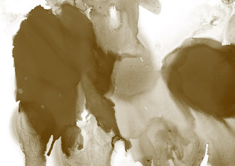 Gold alcohol ink wash texture on clean paper background. Liquid paint flow. Transparent ethereal effect.