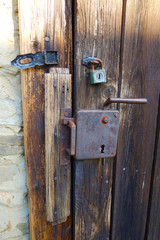 An old lock on a wooden door