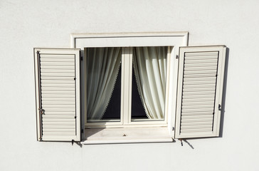 Roof window with roller shutter . detail of building