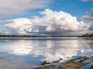 Obraz premium Rain clouds, cumulonimbus, over Gooimeer Lake near Huizen, Netherlands