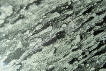 Abstraction with the foam and water over a glass