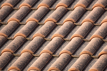 orange roof and blue sky background close up