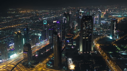 Fototapeta na wymiar Dubai downtown at night with city lights from Burj Khalifa timelapse