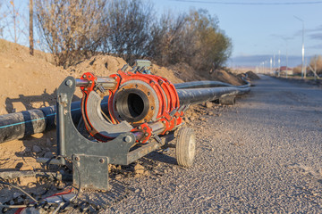 Soldering industrial plastic pipes together for water with soldering machine