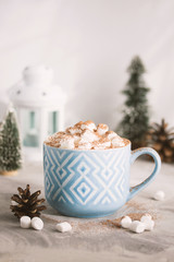 Fototapeta na wymiar Christmas and Happy New Year mug of cacao with marshmallows