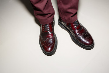 Pair of bordo male classic shoes on white background