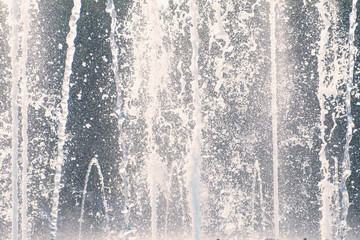 Beautiful fountain jets in summer day close-up.