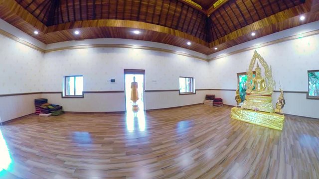 Statue of the Buddha god in the Buddhist temple Brahma Vihara Arama with statues of the gods on Bali island, Indonesia. Bali Architecture, Ancient design. Travel concept.