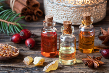 Christmas collection of essential oils with frankincense, myrrh, rose hips, cinnamon