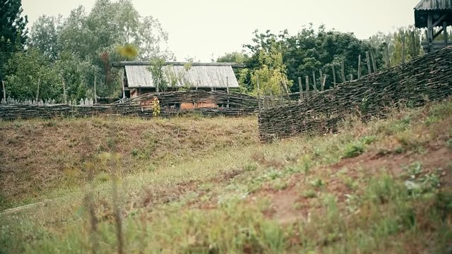 An ancient Slavic pagan city built of wood, excellent scenery for a historical film, old wooden churches and houses, an orthodox cross, summer time, no people in the frame, old Kiev