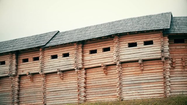 An ancient Slavic pagan city built of wood, excellent scenery for a historical film, old wooden churches and houses, an orthodox cross, summer time, no people in the frame, old Kiev