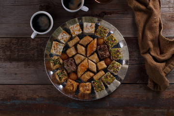 Oriental Dessert Baklava with coffee on silver tray, copy space.