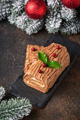 Christmas yule log cake. Traditional chocolate dessert