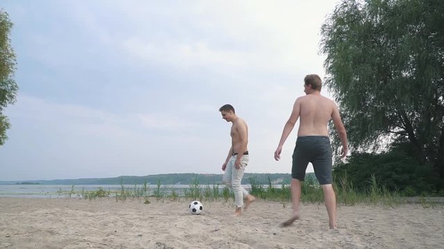 Two teenagers playing football Competition between people Friends have a fun together Spending time outdoors Active lifestyle