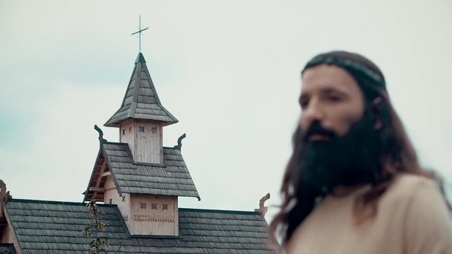 An ancient Slavic pagan city built of wood, excellent scenery for a historical film, old wooden churches and houses, an orthodox cross, summer time, no people in the frame, old Kiev