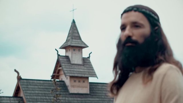 An ancient Slavic pagan city built of wood, excellent scenery for a historical film, old wooden churches and houses, an orthodox cross, summer time, no people in the frame, old Kiev