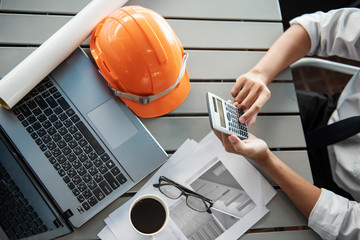 engineers man working  with calculator and laptopn loft office,Building Design,Home or house town planning,engineering tool for sketching a construction project