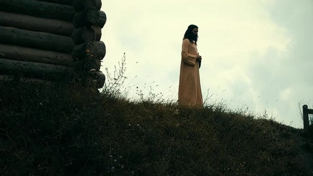 An ancient Slavic pagan city built of wood, excellent scenery for a historical film, old wooden churches and houses, an orthodox cross, summer time, no people in the frame, old Kiev