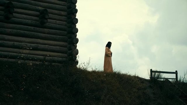 An ancient Slavic pagan city built of wood, excellent scenery for a historical film, old wooden churches and houses, an orthodox cross, summer time, no people in the frame, old Kiev