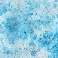 Blue watercolor winter texture with abstract washes and brush strokes on the white paper background.