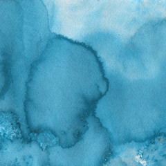 Blue watercolor winter texture with abstract washes and brush strokes on the white paper background.