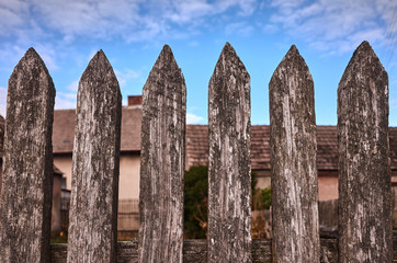 Old wooden fence, color toned picture, selective focus.