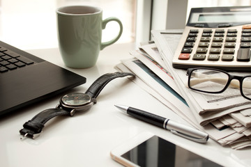 Business table with laptop and coffee