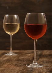 Wine in a glass on a wooden background