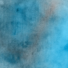 Blue watercolor winter texture with abstract washes and brush strokes on the white paper background.