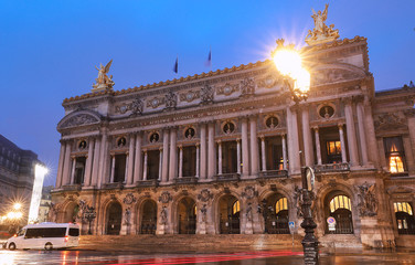 Fototapeta na wymiar Night front view of the Opera National de Paris. Grand Opera is famous neo-baroque building in Paris.