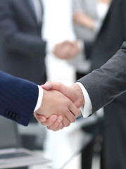concept of cooperation.handshake of business partners