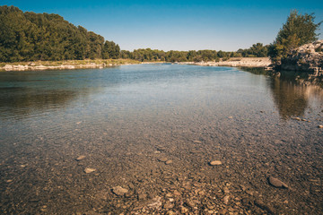 Neighborhoods of the Roman aqueduct Pont du Gard on the river Gardon - recreation area for kayaking, canoeing, rock climbing, and hiking