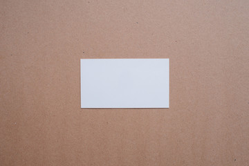 Blank white business card pattern on kraft paper background. Mock-up for designers and other creative people