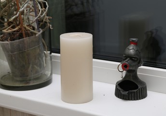 Candle and ashtray 
