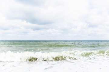 Seascape on cloudy sky background. Sea water and horizon line. Blue sea and sky, horizon line. 