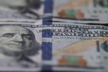 blurred background from banknotes of dollars close up. Dollars Closeup Concept. American Dollars Cash Money. One Hundred Dollar Banknotes.
