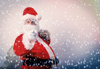 Funny Santa Claus with sack on white background