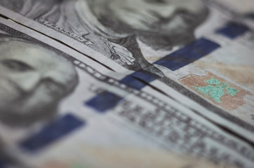 blurred background from banknotes of dollars close up. Dollars Closeup Concept. American Dollars Cash Money. One Hundred Dollar Banknotes.